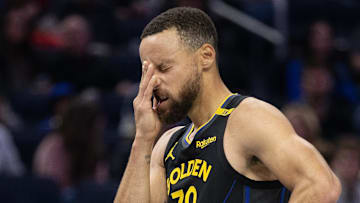 Nov 15, 2024; San Francisco, California, USA; Golden State Warriors guard Stephen Curry (30) reacts after being struck in the face during the second quarter against the Memphis Grizzlies at Chase Center. Mandatory Credit: D. Ross Cameron-Imagn Images