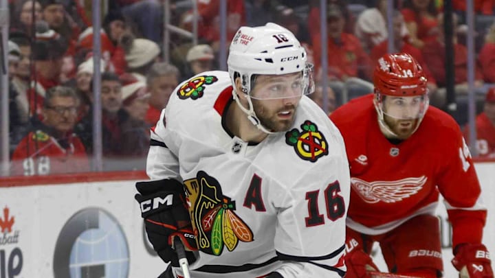 Jan 10, 2025; Detroit, Michigan, USA; Chicago Blackhawks center Jason Dickinson (16) handles the puck during the third period at Little Caesars Arena. Mandatory Credit: Brian Bradshaw Sevald-Imagn Images