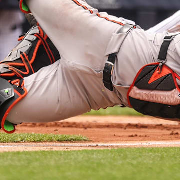 Jun 22, 2025; Bronx, New York, USA; New York Yankees second baseman Jazz Chisholm Jr. (13) collides with Baltimore Orioles catcher Maverick Handley (98) at home plate during the second inning at Yankee Stadium