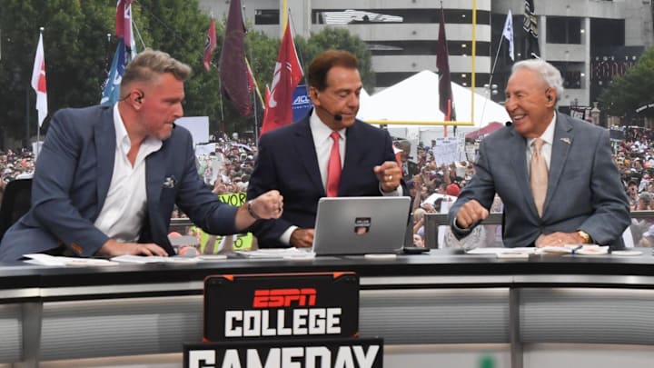 Pat McAfee, Nick Saban, and Lee Corso fist bump before a live broadcast of College GameDay near Williams-Brice Stadium in Columbia, S.C.