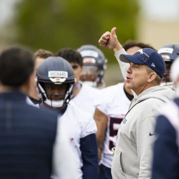 Denver Broncos head coach Sean Payton rallies the rookies during offseason training. 
