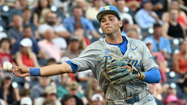 UCLA Bruins shortstop Roch Cholowsky (1) throws to first base