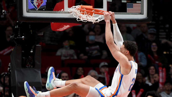 Mar 28, 2022; Portland, Oregon, USA; Oklahoma City Thunder forward Isaiah Roby (22) dunks the ball during the overtime against the Portland Trail Blazers at Moda Center. The Thunder won 134 -131. Mandatory Credit: Steve Dykes-USA TODAY Sports