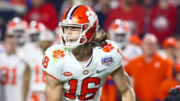 Dec 28, 2019; Glendale, Arizona, USA; Clemson Tigers quarterback Trevor Lawrence (16) runs the ball against the Ohio State Buckeyes in the 2019 Fiesta Bowl college football playoff semifinal game. Mandatory Credit: Matthew Emmons-Imagn Images