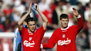 Michael Owen and Steven Gerrard of Liverpool applaud the fans