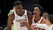 Mar 12, 2025; Charlotte, NC, USA; Stanford Cardinal forward Chisom Okpara (10) reacts with guard Ryan Agarwal (11) after scoring a basket and being fouled late in the second half at Spectrum Center. Mandatory Credit: Bob Donnan-Imagn Images