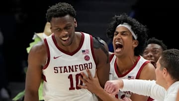 Mar 12, 2025; Charlotte, NC, USA; Stanford Cardinal forward Chisom Okpara (10) reacts with guard Ryan Agarwal (11) after scoring a basket and being fouled late in the second half at Spectrum Center. Mandatory Credit: Bob Donnan-Imagn Images