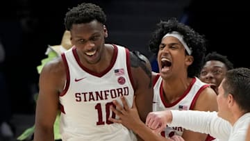 Mar 12, 2025; Charlotte, NC, USA; Stanford Cardinal forward Chisom Okpara (10) reacts with guard Ryan Agarwal (11) after scoring a basket and being fouled late in the second half at Spectrum Center. Mandatory Credit: Bob Donnan-Imagn Images