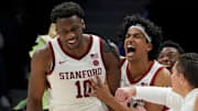 Mar 12, 2025; Charlotte, NC, USA; Stanford Cardinal forward Chisom Okpara (10) reacts with guard Ryan Agarwal (11) after scoring a basket and being fouled late in the second half at Spectrum Center. Mandatory Credit: Bob Donnan-Imagn Images
