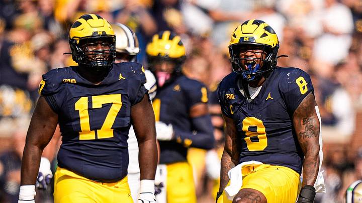 Michigan edge Derrick Moore (8) celebrates a sack against Washington quarterback Demond Williams Jr. (2) during the first half at Michigan Stadium in Ann Arbor on Saturday, Oct. 18, 2025.
