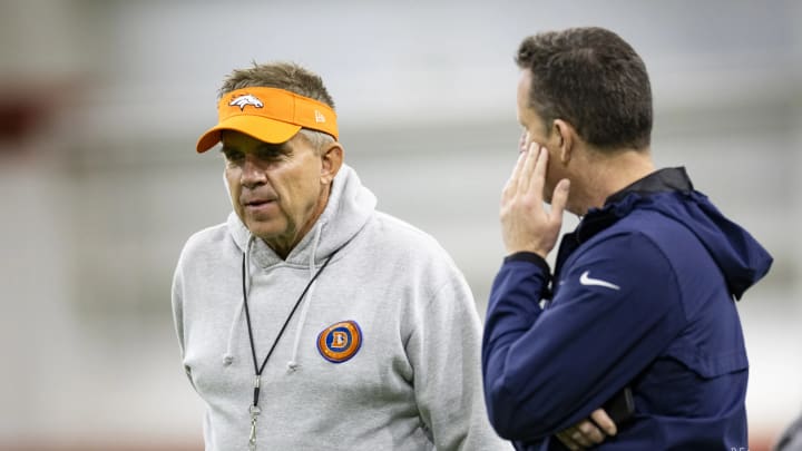 Denver Broncos head coach Sean Payton and general manager George Paton talk during OTA practice. 