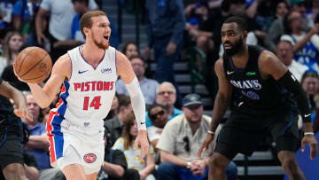 Apr 12, 2024; Dallas, Texas, USA; Detroit Pistons guard Malachi Flynn (14)  controls the ball as Dallas Mavericks forward Tim Hardaway Jr. (10) defends during the first half at American Airlines Center. Mandatory Credit: Chris Jones-USA TODAY Sports