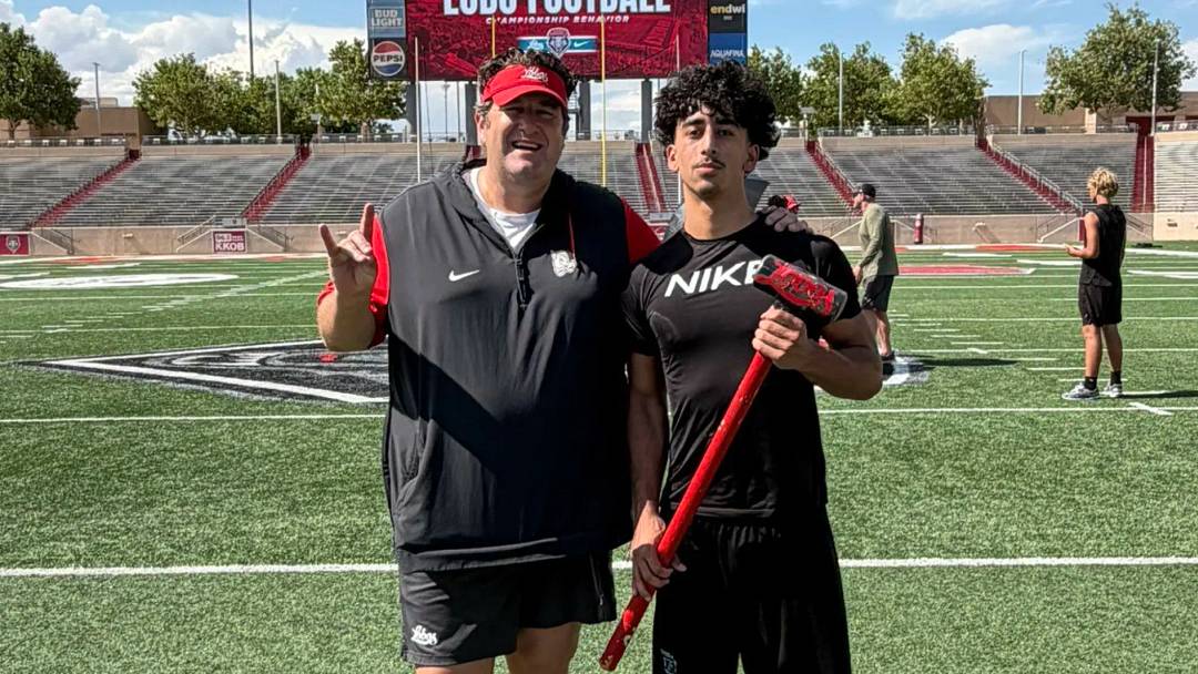 Class of 2028's Evan Nanez, who holds D1 offers for football and basketball, poses with University of New Mexico football head coach Jason Eck. Class of 2028's Evan Nanez, who holds D1 offers for football and basketball, poses with University of New Mexico football head coach Jason Eck.