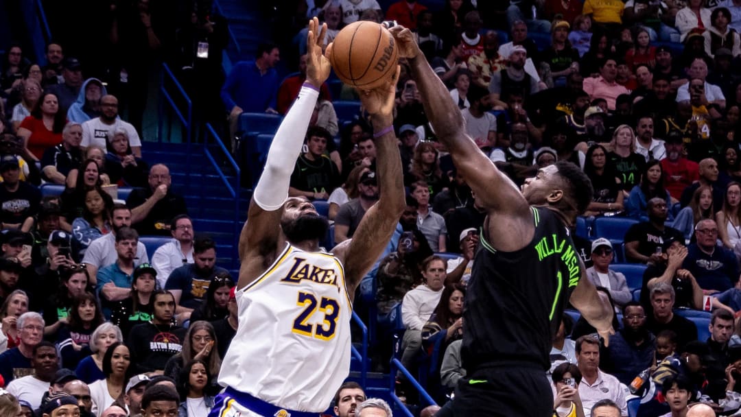 Apr 14, 2024; New Orleans, Louisiana, USA; New Orleans Pelicans forward Zion Williamson (1) blocks the shot attempt of Los Angeles Lakers forward LeBron James (23) during the second half at Smoothie King Center. 