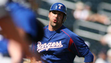 Mar 2, 2006; Surprise, AZ, USA; Texas Rangers infielder (7) Mark DeRosa beats the throw home against the Kansas City Royals at Surprise Stadium. 