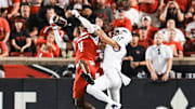 Louisville Cardinals defensive back Jabari Mack (4) intercepted a pass meant for James Madison Dukes wide receiver Nick DeGennaro (11) as the Cards defeated the James Madison University Dukes 28-14 Friday September 5, 2025 at L&N Federal Credit Union Stadium in Louisville, Kentucky.