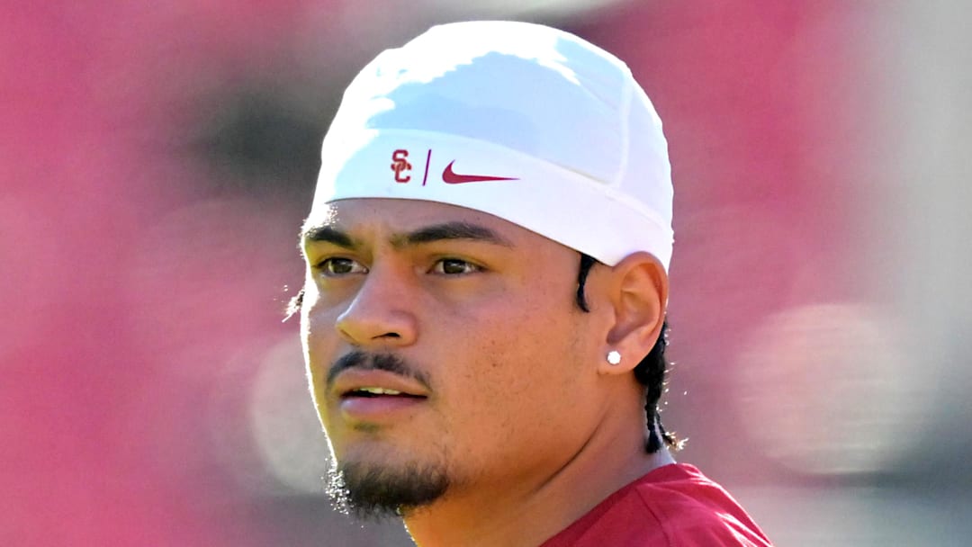 Oct 11, 2025; Los Angeles, California, USA;  USC Trojans quarterback Jayden Maiava (14) warms up prior to the game against the Michigan Wolverines at United Airlines Field at the Los Angeles Memorial Coliseum. 