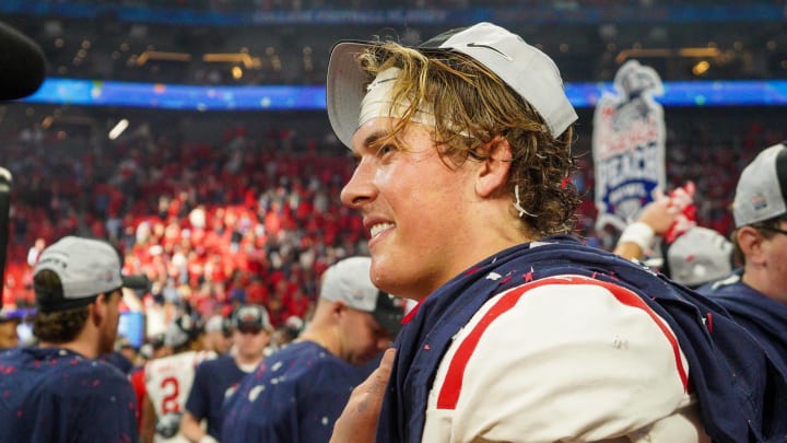 Dec 30, 2023; Atlanta, GA, USA; Mississippi Rebels quarterback Jaxson Dart (2) celebrates after a victory against the Penn State Nittany Lions in the Peach Bowl at Mercedes-Benz Stadium. Mandatory Credit: Brett Davis-USA TODAY Sports