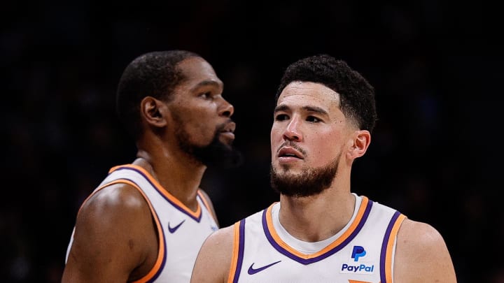 Mar 27, 2024; Denver, Colorado, USA; Phoenix Suns guard Devin Booker (1) and forward Kevin Durant (35) in the third quarter against the Denver Nuggets at Ball Arena. Mandatory Credit: Isaiah J. Downing-USA TODAY Sports