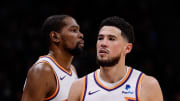 Mar 27, 2024; Denver, Colorado, USA; Phoenix Suns guard Devin Booker (1) and forward Kevin Durant