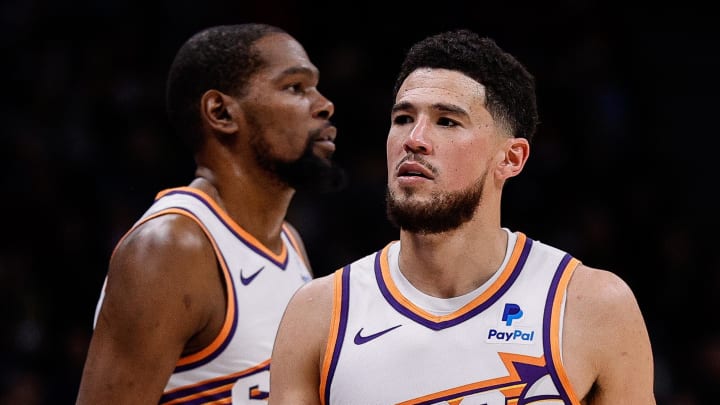 Phoenix Suns guard Devin Booker (1) and forward Kevin Durant (35) in the third quarter against the Denver Nuggets at Ball Arena. Mandatory Credit: