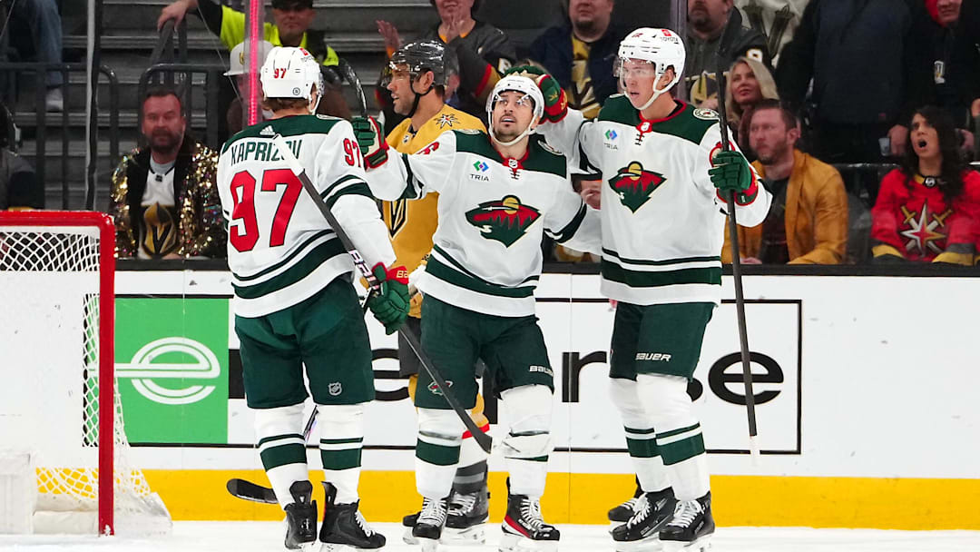 Feb 12, 2024; Las Vegas, Nevada, USA; Minnesota Wild right wing Mats Zuccarello (36) celebrates with Minnesota Wild left wing Kirill Kaprizov (97) and Minnesota Wild center Joel Eriksson Ek (14) after scoring a goal against the Vegas Golden Knights during the first period at T-Mobile Arena. Mandatory Credit: Stephen R. Sylvanie-Imagn Images