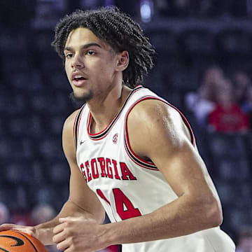 Feb 5, 2025; Athens, Georgia, USA; Georgia Bulldogs forward Asa Newell (14) handles the ball against the LSU Tigers during the second half at Stegeman Coliseum.