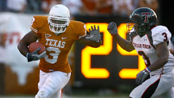 Nov 10, 2007; Austin, TX, USA; Texas Longhorns runningback Chris Ogbonnaya (3) is pursued by Texas Tech Red Raiders defensive back Jamar Wall (3) in the third quarter at Darrell K Royal-Texas Memorial Stadium in Austin, Texas. Texas beat Texas Tech 59-43. Mandatory Credit: Brendan Maloney-Imagn Images