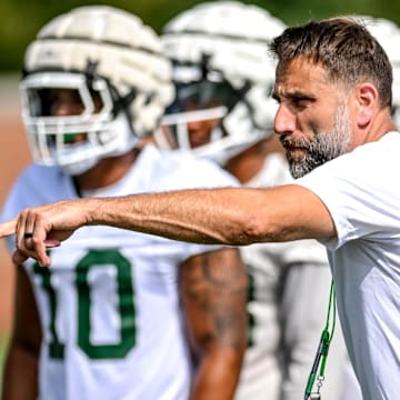 Michigan State's defensive coordinator Joe Rossi works with the defense during the first day of football camp on Tuesday, July 30, 2024, in East Lansing.