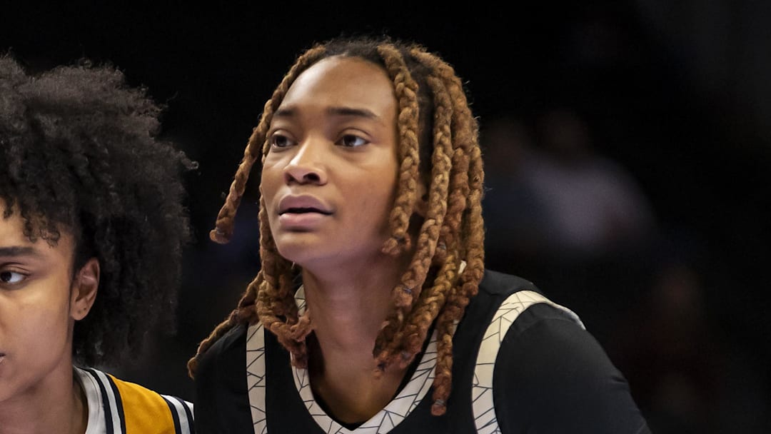 Mar 7, 2026; Kansas City, MO, USA;  West Virginia guard Sydney Shaw (5) gets set for a throw in against Colorado Buffaloes forward Jade Masogayo (14) during the second half at T-Mobile Center. Mandatory Credit: Nick Tre. Smith-Imagn Images