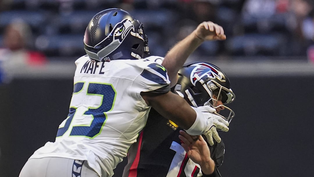 Seattle Seahawks linebacker Boye Mafe (53) hits Atlanta Falcons quarterback Kirk Cousins (18) 