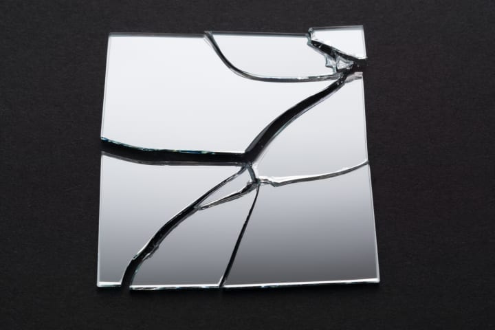 A square mirror that is broken