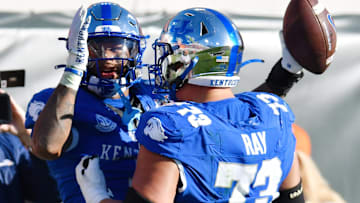 Kentucky Wildcats running back Ray Davis (1) celebrates with teammate offensive lineman Dylan Ray (73) after his touchdown to give Kentucky a 30 to 34 lead with under three minutes to play in the game. The Kentucky Wildcats faced off against the Clemson Tigers Friday, December 29, 2023, in the TaxSlayer Gator Bowl in Jacksonville, Florida. The Wildcats led 14 to 10 at the half but the Tigers fought back and came away with a 38 to 35 victory. [Bob Self/Florida Times-Union]