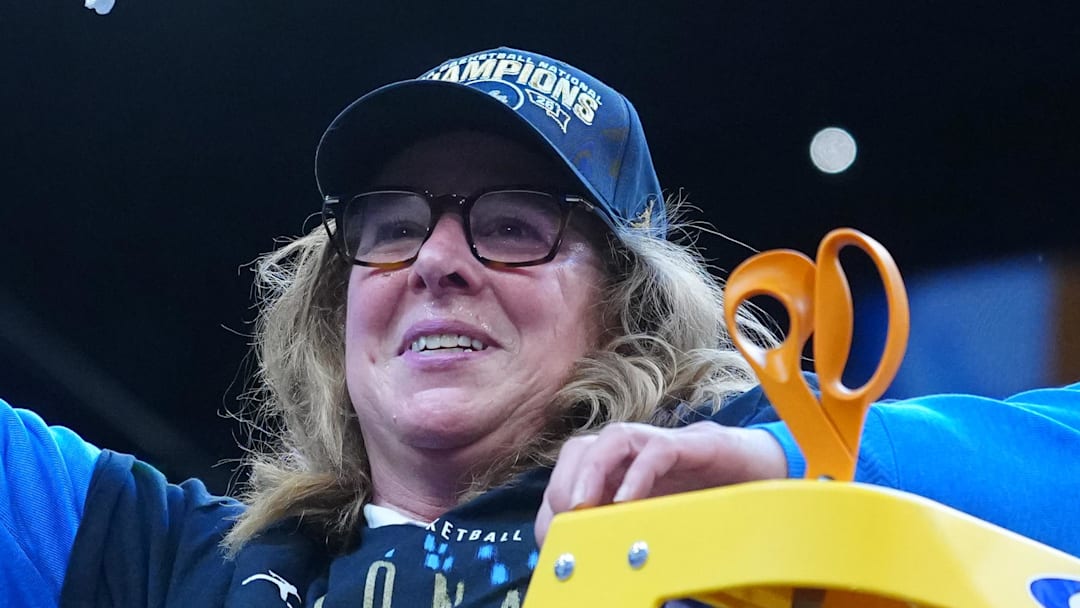 Apr 5, 2026; Phoenix, AZ, USA; UCLA Bruins head coach Cori Close cuts down the net after defeating the South Carolina Gamecocks during the National Championship game of the women's 2026 NCAA Tournament at Mortgage Matchup Center. Mandatory Credit: Kirby Lee-Imagn Images