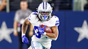 Dallas Cowboys running back Jaydon Blue carries the ball during the fourth quarter against the Atlanta Falcons 