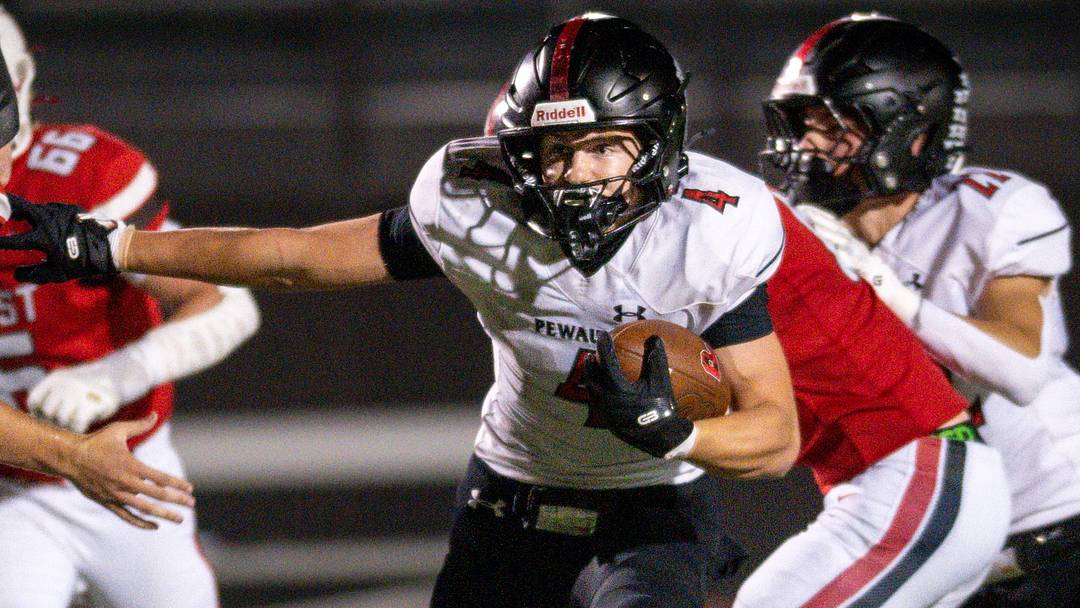 Pewaukee running back Colton Wall (4) looks for room to run versus Wauwautosa East in a Parkland Conference game on September 11, 2026.