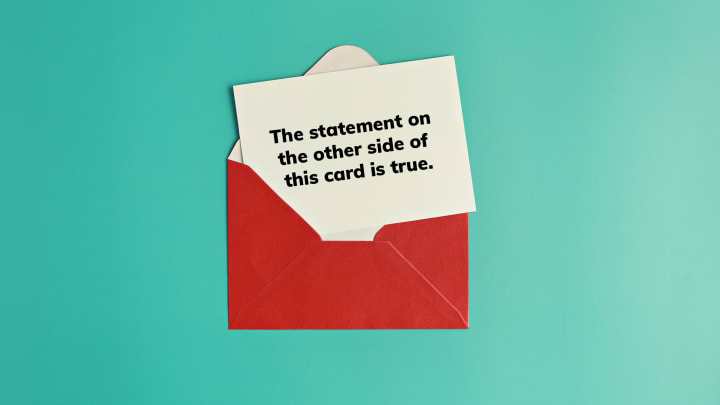 A card that reads "the statement on the other side of this card is true" in a red envelope on a teal background