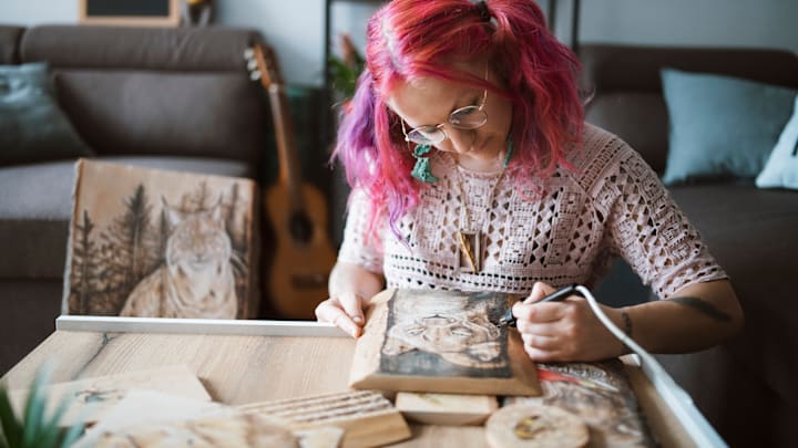 A southpaw works on a craft project.