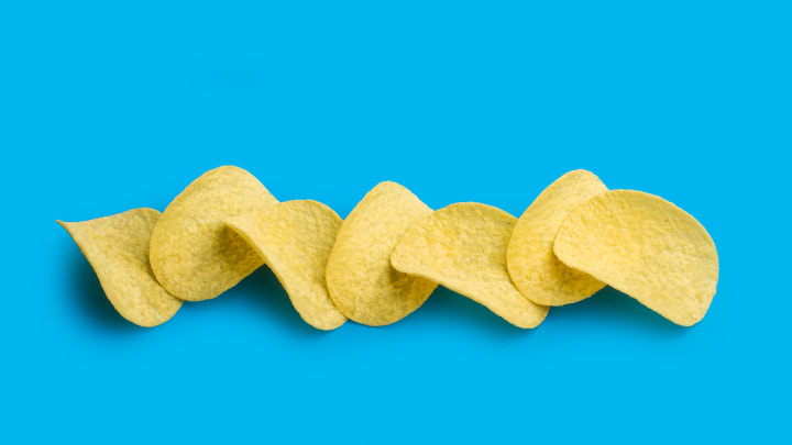 Potato chips on a blue background