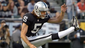 Aug 23, 2013; Oakland, CA, USA; Oakland Raiders punter Chris Kluwe (5) punts the ball during the game against the Chicago Bears at O.co Coliseum.
