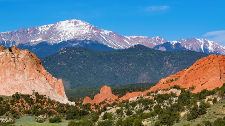 Garden of the Gods in early summer with snow-capped Pikes Peak in the background.