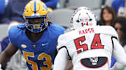Oct 25, 2025; Pittsburgh, Pennsylvania, USA;  Pittsburgh Panthers offensive lineman Kendall Stanley (53) blocks at the line of scrimmage against North Carolina State Wolfpack defensive end Sabastian Harsh (54) during the second quarter at Acrisure Stadium. Mandatory Credit: Charles LeClaire-Imagn Images