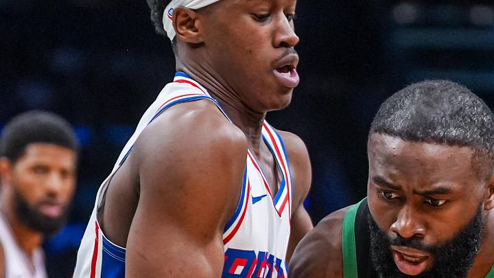 Apr 28, 2026; Boston, Massachusetts, USA; Boston Celtics guard Jaylen Brown (7) drives the ball against Philadelphia 76ers guard Vj Edgecombe (77) in the second half during game five of the first round of the 2026 NBA Playoffs at TD Garden. Mandatory Credit: David Butler II-Imagn Images