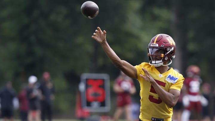 Jul 26, 2024; Ashburn, VA, USA; Washington Commanders quarterback Jayden Daniels (5) passes the ball on day three of training camp at Commanders Park. Mandatory Credit: Geoff Burke-USA TODAY Sports Jul 26, 2024; Ashburn, VA, USA; Washington Commanders quarterback Jayden Daniels (5) passes the ball on day three of training camp at Commanders Park. Mandatory Credit: Geoff Burke-USA TODAY Sports