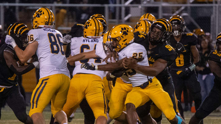 Brandon Caesar of Cleveland Heights makes a tackle in the backfield against St. Ignatius on November 4, 2022. 