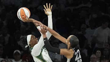 Sep 14, 2025; Las Vegas, Nevada, USA; Seattle Storm center Dominique Malonga (14) shoots against Las Vegas Aces center A'ja Wilson (22) in the first quarter during game one of round one for the 2025 WNBA Playoffs at Michelob Ultra Arena. Mandatory Credit: Candice Ward-Imagn Images