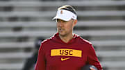 Oct 19, 2024; College Park, Maryland, USA;  Southern California Trojans head coach Lincoln Riley stands on the field before the game against the Maryland Terrapins at SECU Stadium. Mandatory Credit: Tommy Gilligan-Imagn Images