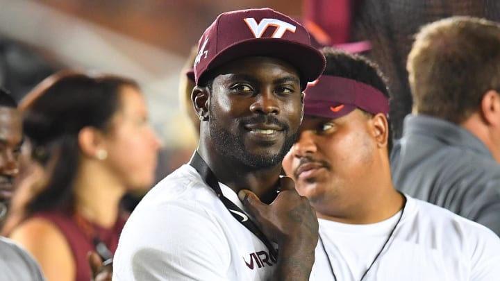 Sep 10, 2016; Bristol, TN, USA; Virginia Tech Hokies former player Michael Vick looks on from the sidelines during the first half of the Battle at Bristol at Bristol Motor Speedway. Mandatory Credit: Christopher Hanewinckel-USA TODAY Sports