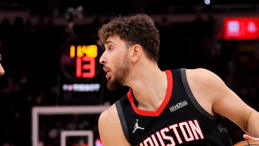 Jan 26, 2026; Houston, Texas, USA; Houston Rockets center Alperen Sengun (28) handles the ball against Memphis Grizzlies forward Santi Aldama (7) during the first quarter at Toyota Center. Mandatory Credit: Erik Williams-Imagn Images