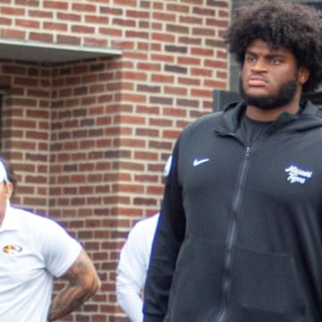 Sept 20, 2025; Columbia, Missouri, USA; Missouri Tigers left tackle Cayden Green exits the locker room in a boot ahead of the Missouri Tigers Week 4 matchup against South Carolina.